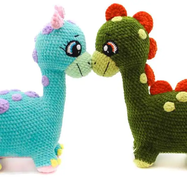 Dino family plush toys arranged together