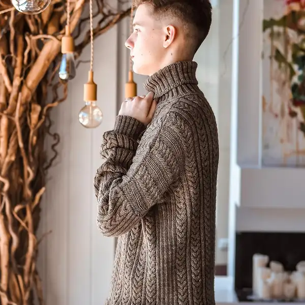 Lifestyle shot of Crossbill sweater with neutral-toned pants