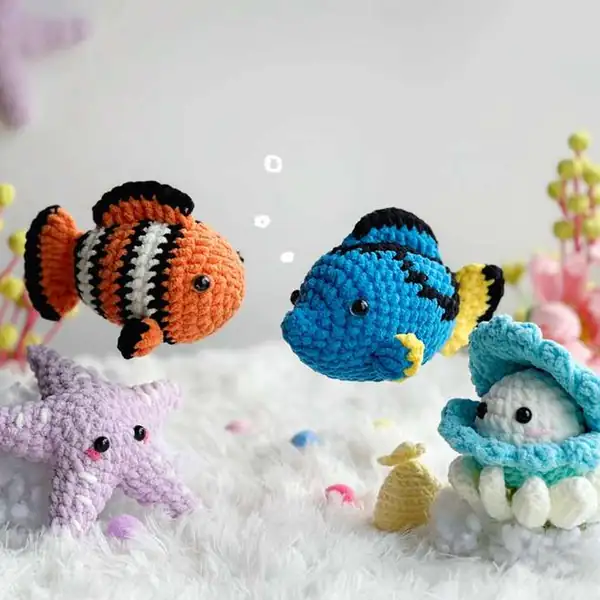 Two seashell pieces sewn together with pearl