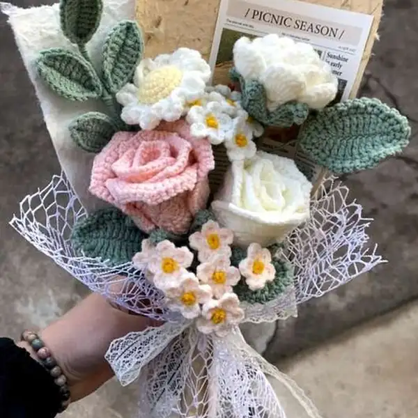 Close-up of rose-type crochet flowers with layers of petals