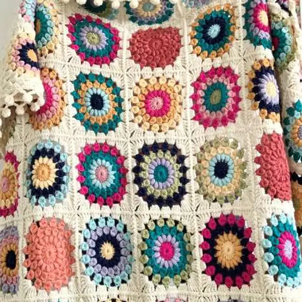 Row of colorful crochet squares laid out in a grid before joining