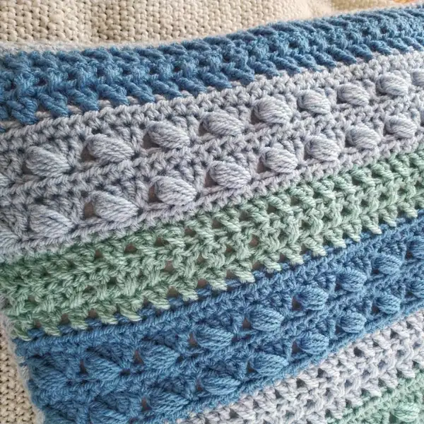 Two finished panels laid right sides together before sewing to form the cushion cover amigurumi project