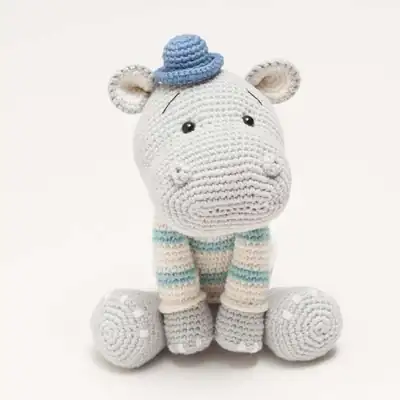 Grey hippo head with blue hat amigurumi (front view)