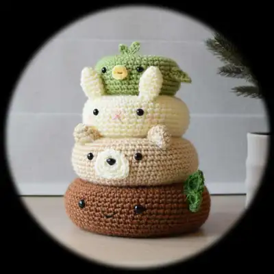Birdie amigurumi perched atop a little woodland stack