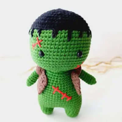 green Frankenstein amigurumi head close up