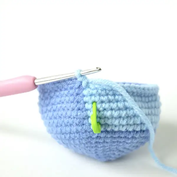 Back and side view of Stitch amigurumi highlighting ear seam and tail attachment, crochet doll