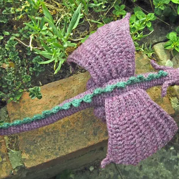 Dragon with wings spread and tail spikes