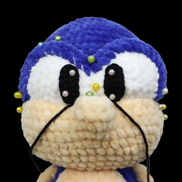Pinned eyelids and eye whites placed on the Super-Prickle head prior to sewing to illustrate proper placement.