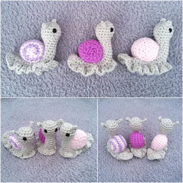Close-up group shot of three finished Garden Snails showing shell ridge texture and embroidered eyes on chunky yarn amigurumi