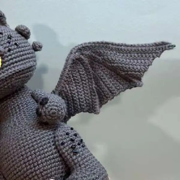 Finished Dragon Toothless amigurumi with flowers