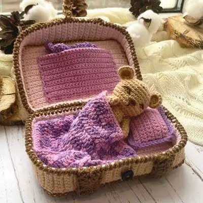 Beige teddy inside pink suitcase amigurumi