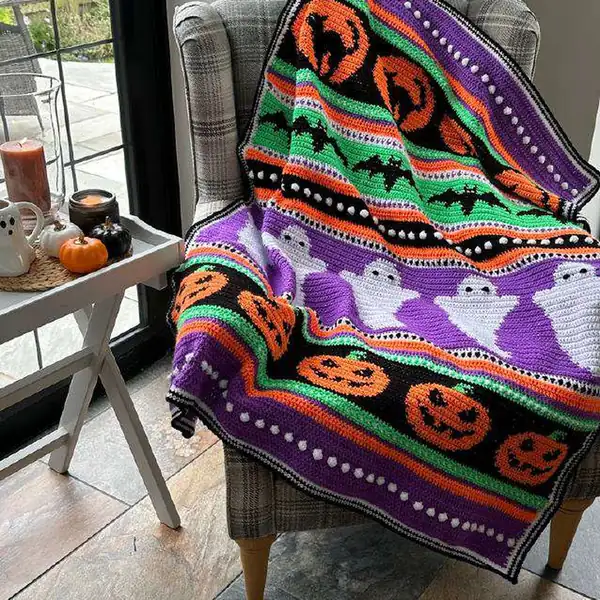 Finished Halloween Dreams blanket with a purple edge