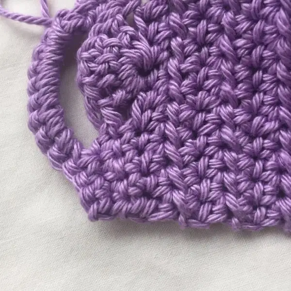 Close-up of shell-edged crochet on cup