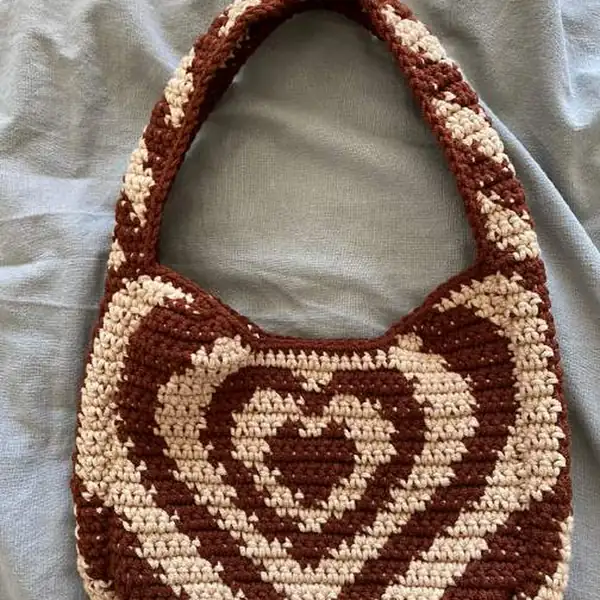 Close-up of the heart tapestry pattern on the bag