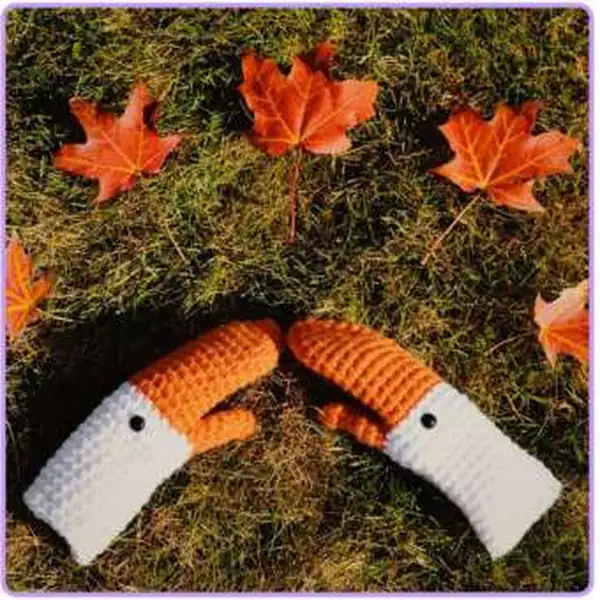 Finished goose mittens worn on hands