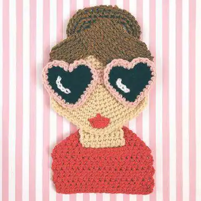 Face close-up crochet girl amigurumi with sunglasses