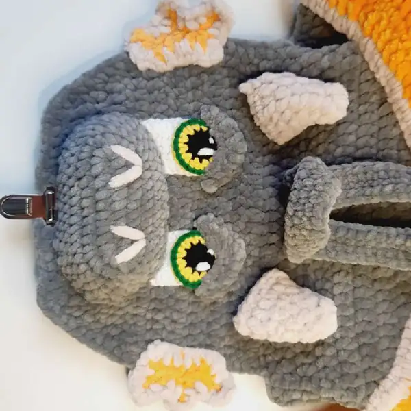 Backpack base with straps laid open, gray plush yarn