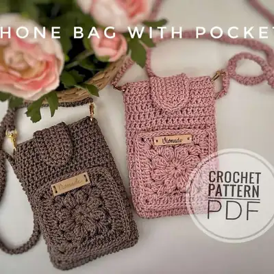 Phone bag with pocket in warm brown yarn, front view amigurumi style