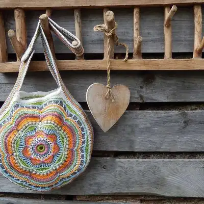 Finished Boho Flower Bag with colorful concentric rounds and strap