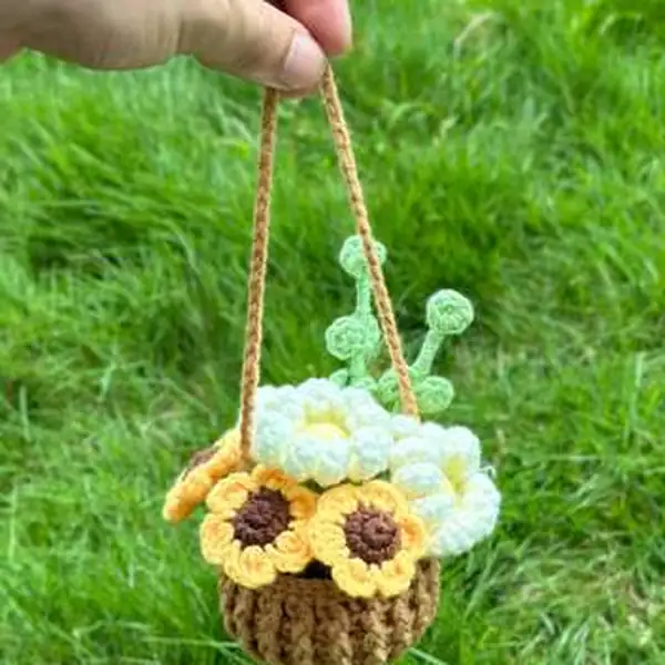 Hanging bouquet with daisies swaying in car interior