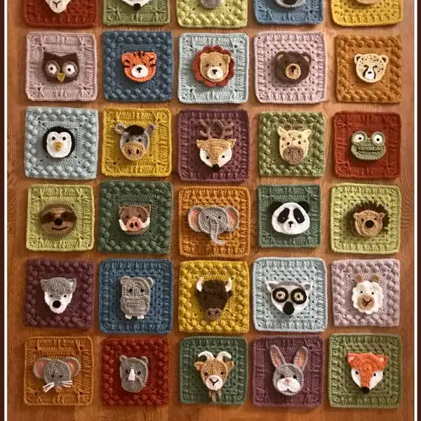 Close-up of animal appliques on a square