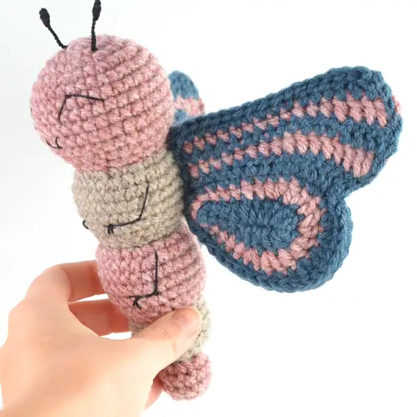 Wings panel of Ava the Butterfly with denim and rose tones