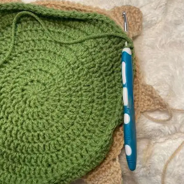 Finished mama turtle with babies stored inside and button closure visible on the tail