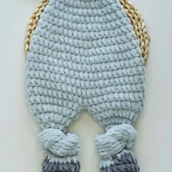 Finished hippo lovey laid flat showing knitted chenille texture amigurumi