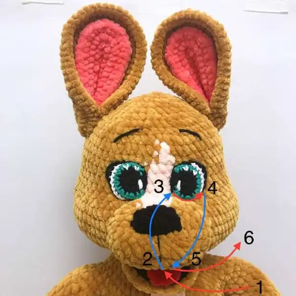 Finished kangaroo amigurumi posed for display