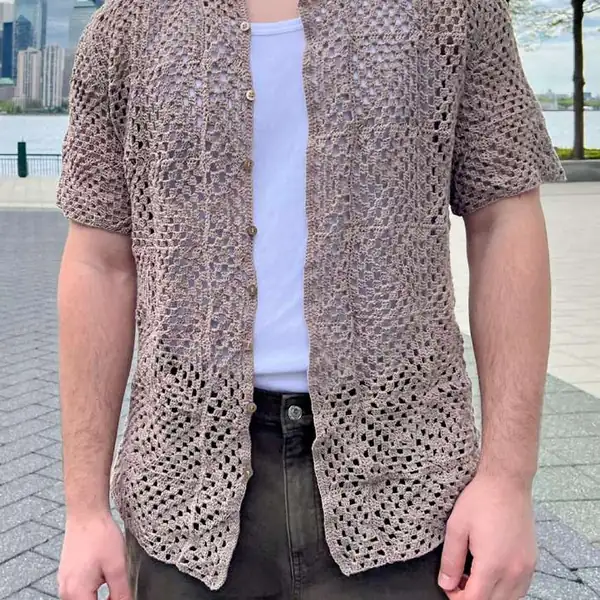 Flat-lay of finished Amalfi top showing front panels, button band and collar in crochet